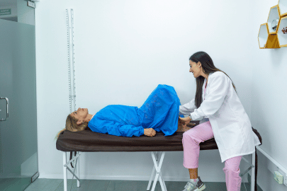 obgyn conducting pelvic exam to patient